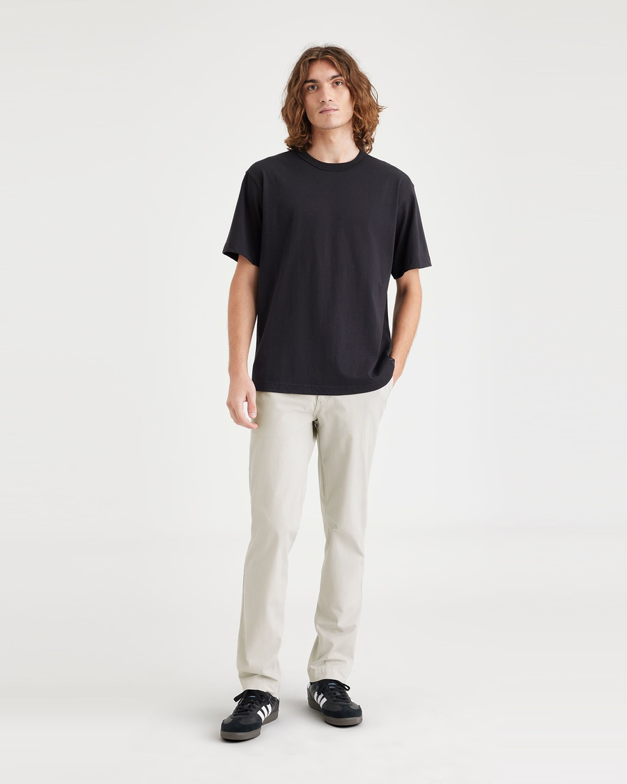 Front view of model wearing Grit Men's Slim Fit Smart 360 Flex California Chino Pants.