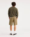 Back view of model wearing Harvest Gold Alpha 8" Shorts.