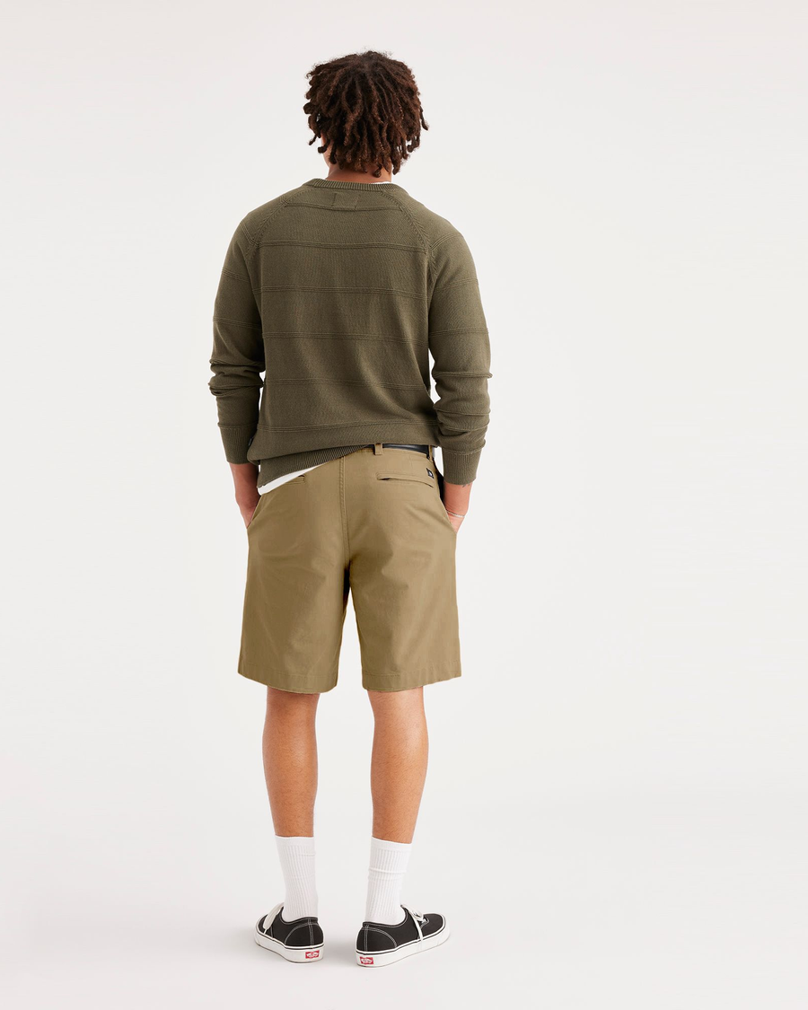 Back view of model wearing Harvest Gold Alpha 8" Shorts.