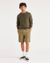 Front view of model wearing Harvest Gold Alpha 8" Shorts.