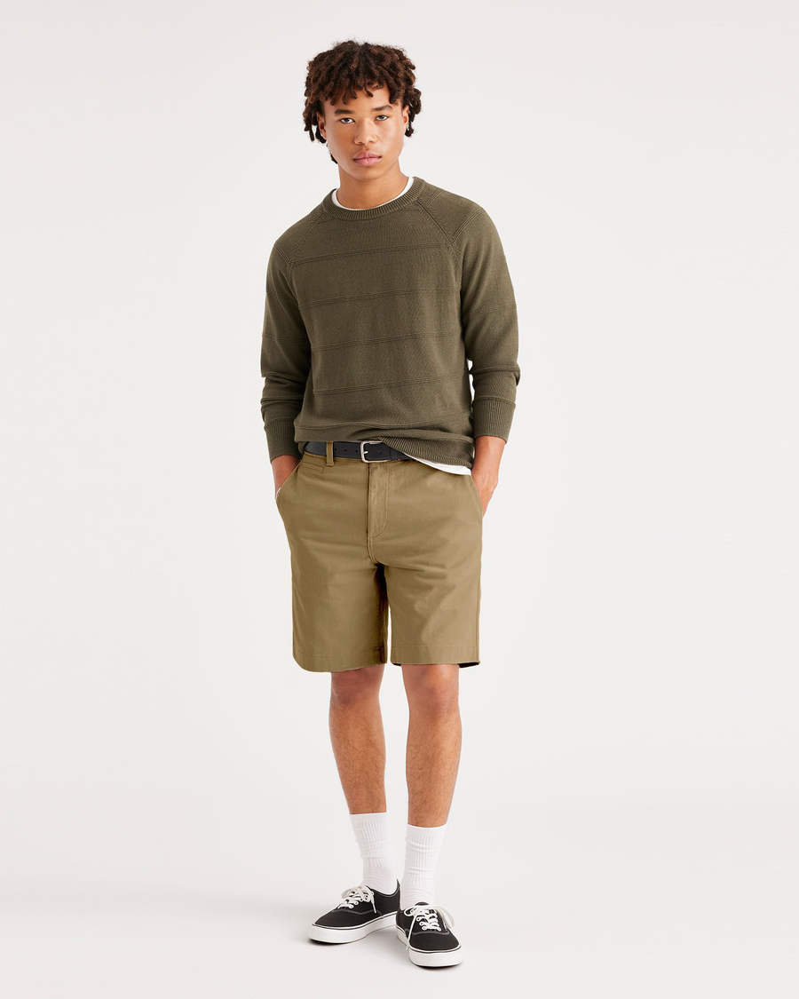 Front view of model wearing Harvest Gold Alpha 8" Shorts.