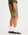 Side view of model wearing Harvest Gold Alpha 8" Shorts.