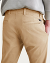 View of model wearing Harvest Gold Alpha Chino Pants, Skinny Fit.