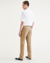 Back view of model wearing Harvest Gold Alpha Chino Pants, Slim Fit.