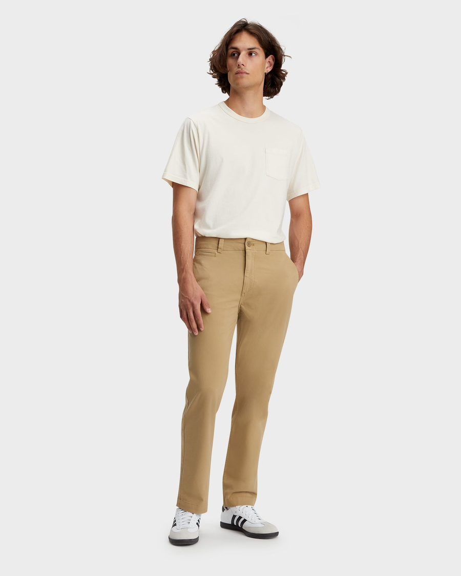 Front view of model wearing Harvest Gold Alpha Chino Pants, Straight Fit.