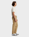 Side view of model wearing Harvest Gold Alpha Chino Pants, Straight Fit.