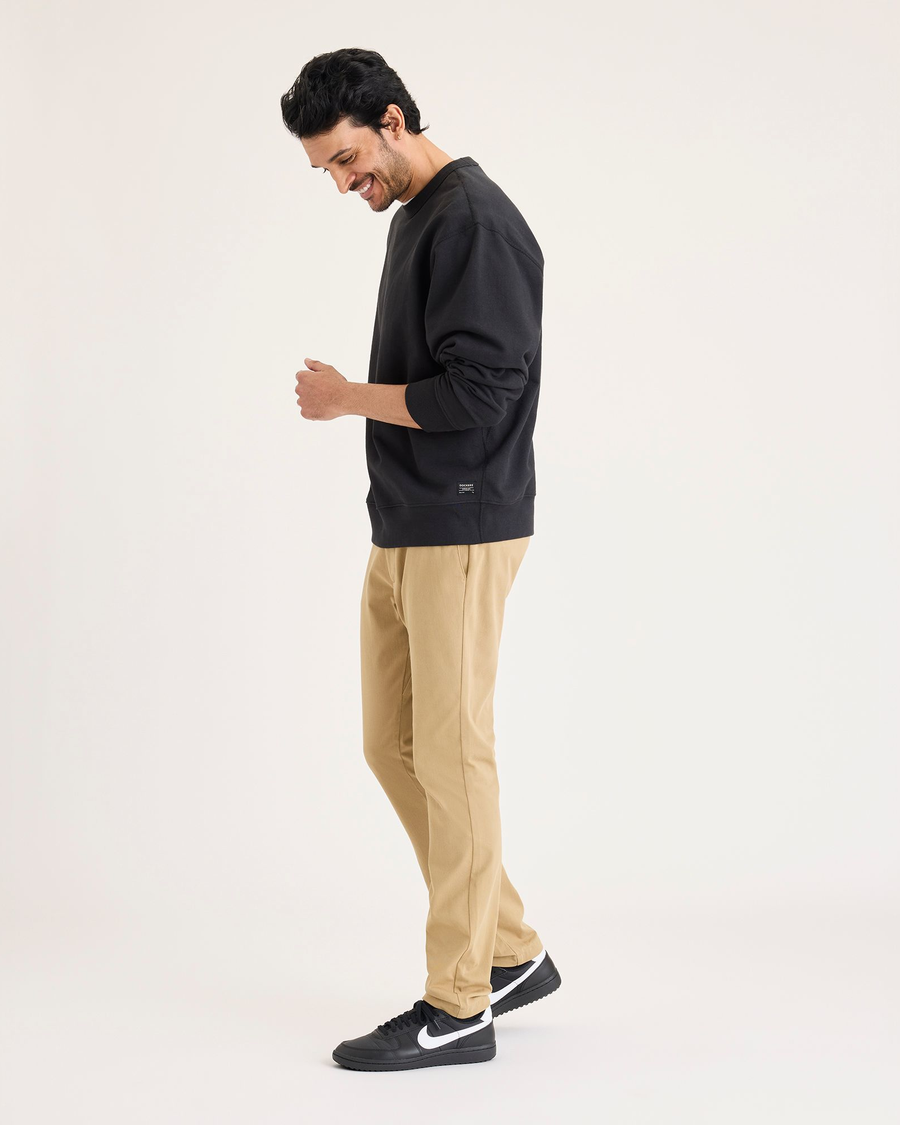 View of model wearing Harvest Gold Go Activeflex Chino, Skinny Fit.