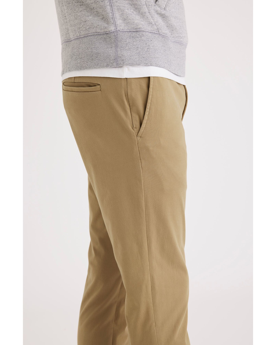 Side view of model wearing Harvest Gold Go Chino, Skinny Fit.