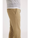 Side view of model wearing Harvest Gold Go Chino, Skinny Fit.