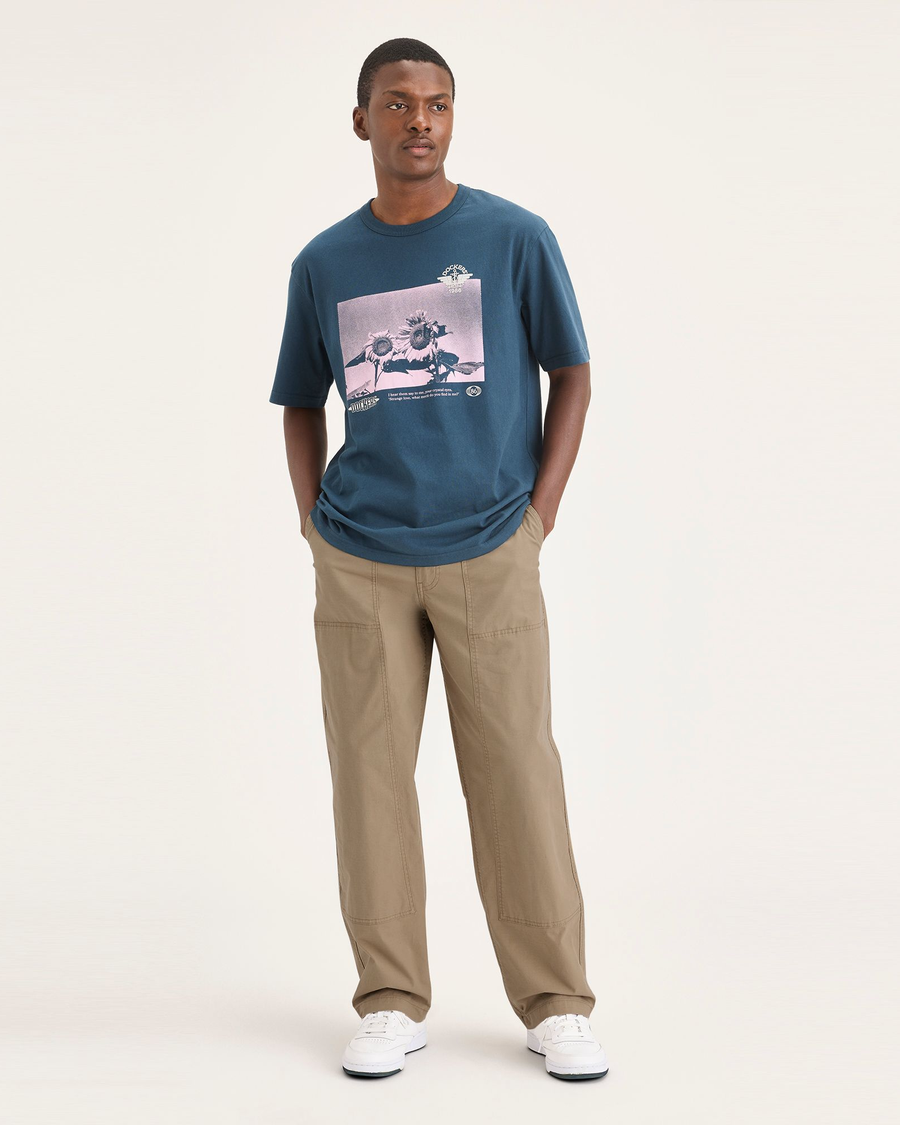 Front view of model wearing Harvest Gold Men's Loose Fit Eighty-Six Utility Pants.