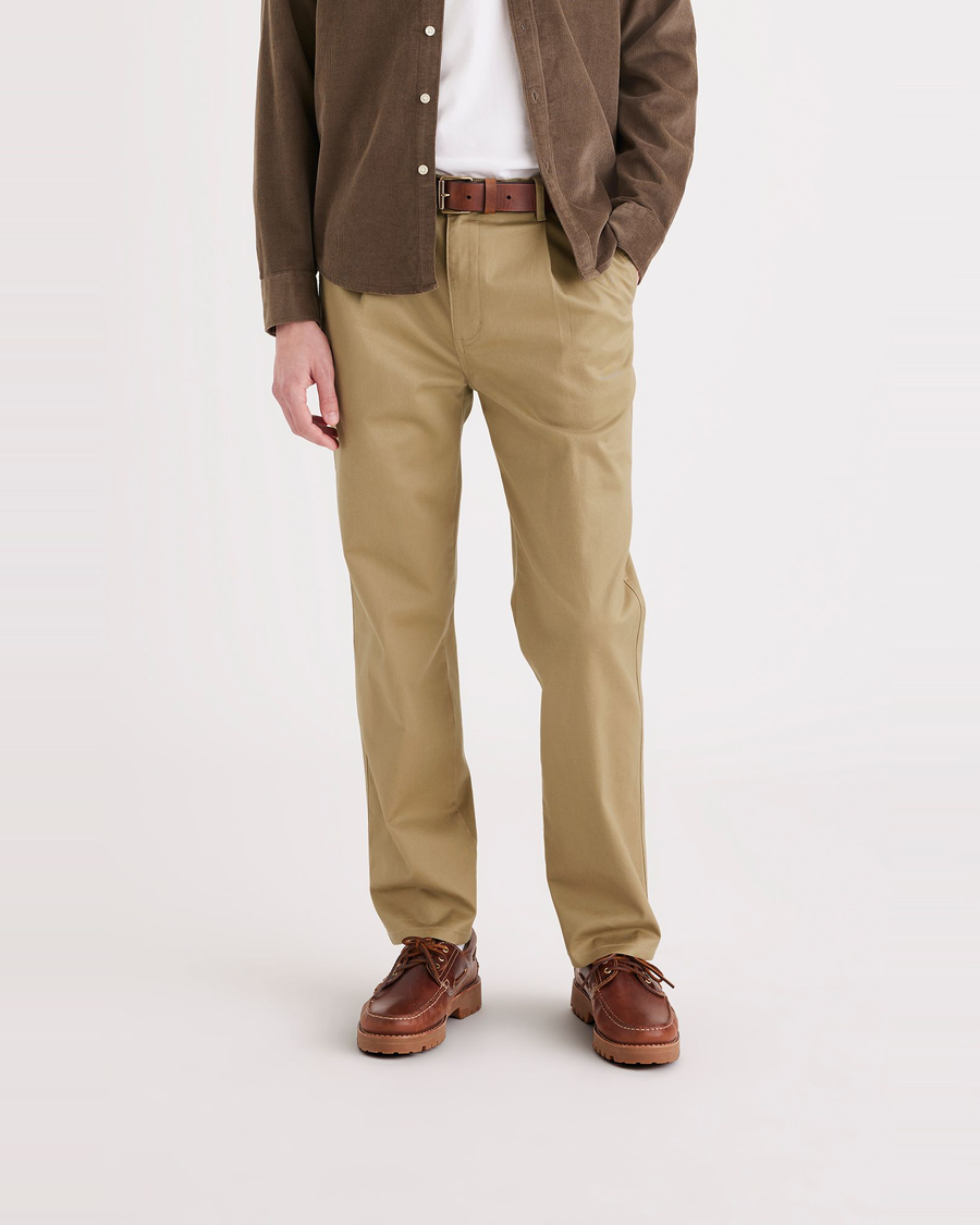 Front view of model wearing Harvest Gold Men's Relaxed Tapered Fit Original Chino Pants.