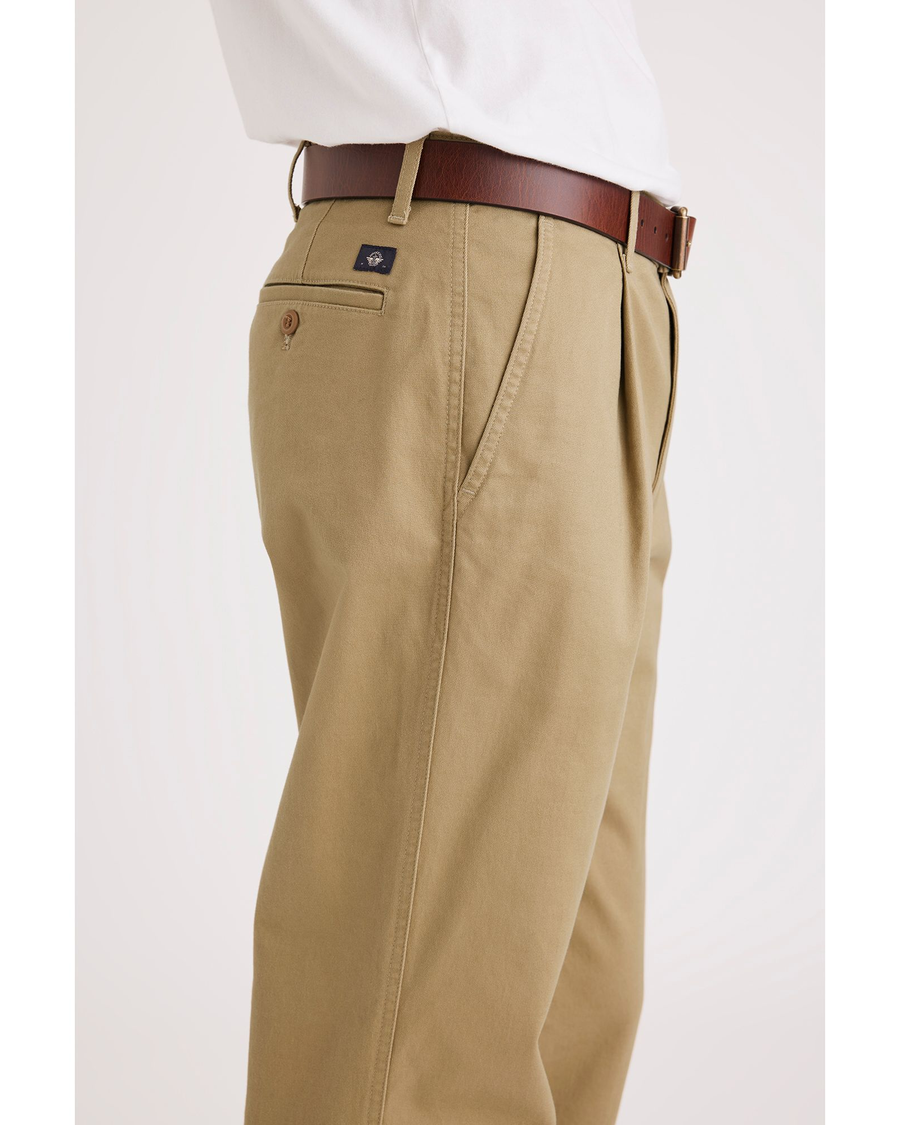 Side view of model wearing Harvest Gold Men's Relaxed Tapered Fit Original Chino Pants.