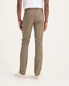 Back view of model wearing Harvest Gold Men's Skinny Fit Original Chino Pants.