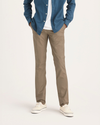 Front view of model wearing Harvest Gold Men's Skinny Fit Original Chino Pants.