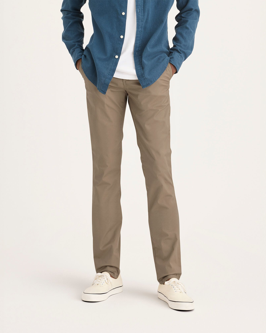 Front view of model wearing Harvest Gold Men's Skinny Fit Original Chino Pants.