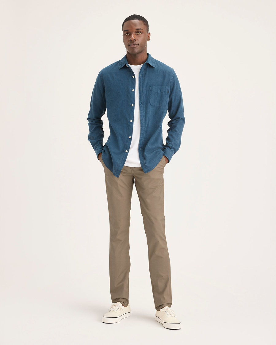 Front view of model wearing Harvest Gold Men's Skinny Fit Original Chino Pants.