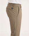 Side view of model wearing Harvest Gold Men's Skinny Fit Original Chino Pants.