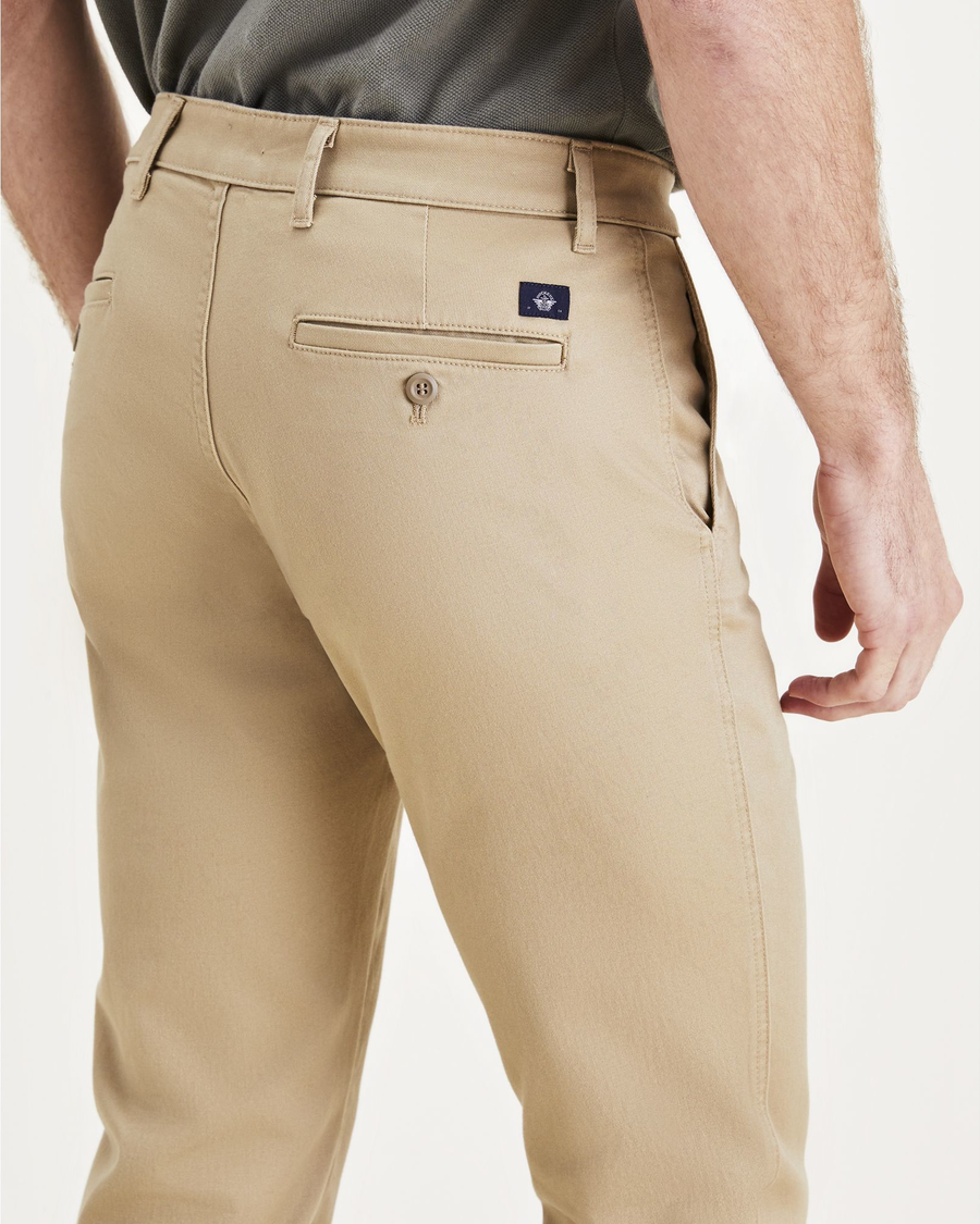 View of model wearing Harvest Gold Men's Slim Fit Original Chino Pants.