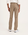 Back view of model wearing Harvest Gold Men's Slim Fit Original Chino Pants.