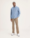 Front view of model wearing Harvest Gold Men's Slim Fit Original Chino Pants.