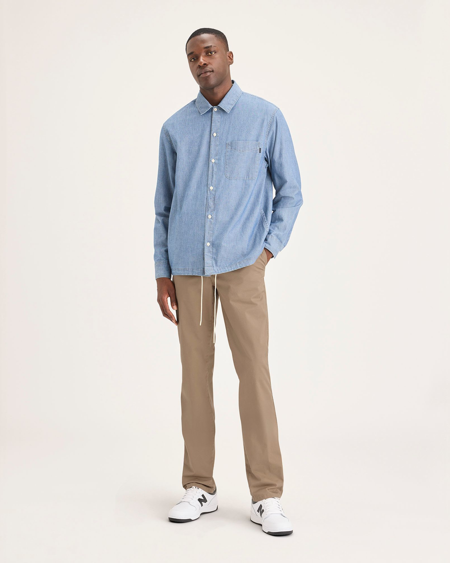 Front view of model wearing Harvest Gold Men's Slim Fit Original Chino Pants.