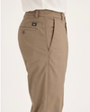 Side view of model wearing Harvest Gold Men's Slim Fit Original Chino Pants.