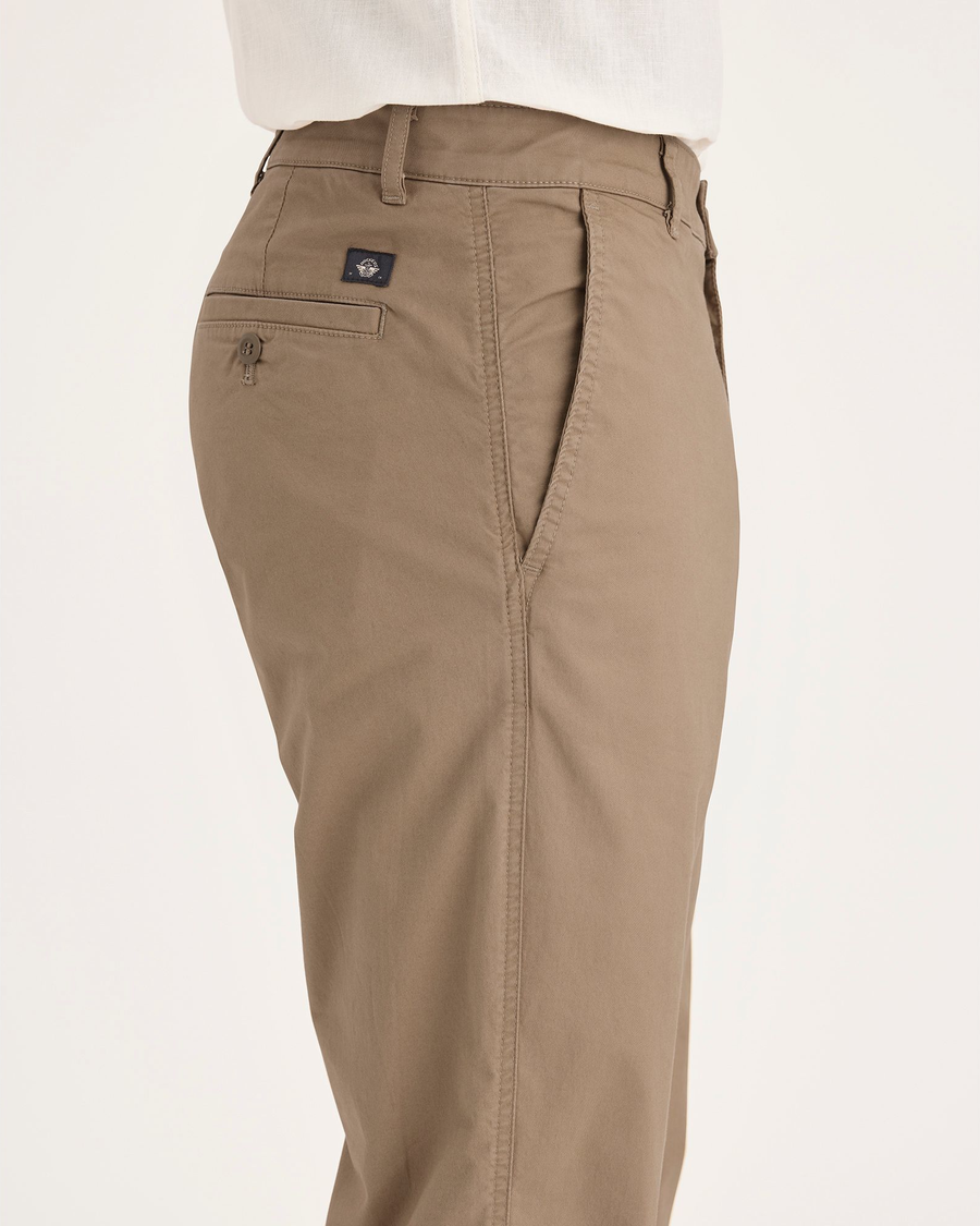 Side view of model wearing Harvest Gold Men's Slim Fit Original Chino Pants.