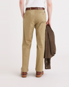 Back view of model wearing Harvest Gold Original Chinos, Relaxed Tapered Fit.