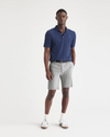 Front view of model wearing High-Rise Men's Supreme Flex Modern Chino Short.