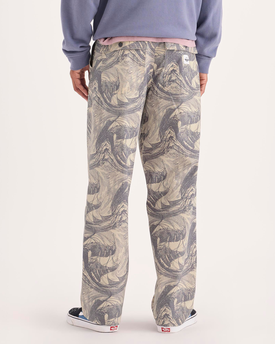 Back view of model wearing Ichabod Buttercream Eighty-Six Utility Pants, Loose Fit.