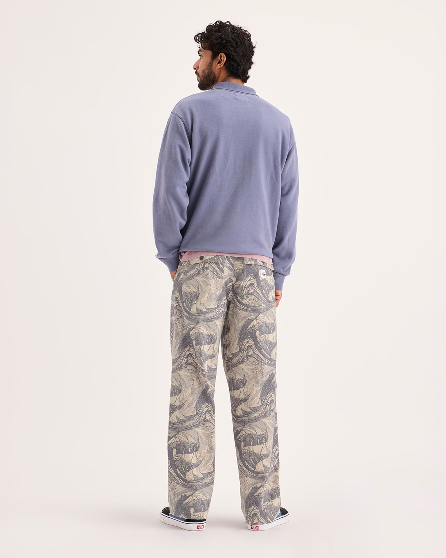 Back view of model wearing Ichabod Buttercream Eighty-Six Utility Pants, Loose Fit.