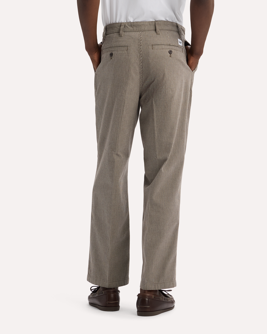 View of model wearing Lemon Pepper Eighty-Six Original Pleated Chinos, Loose Fit.