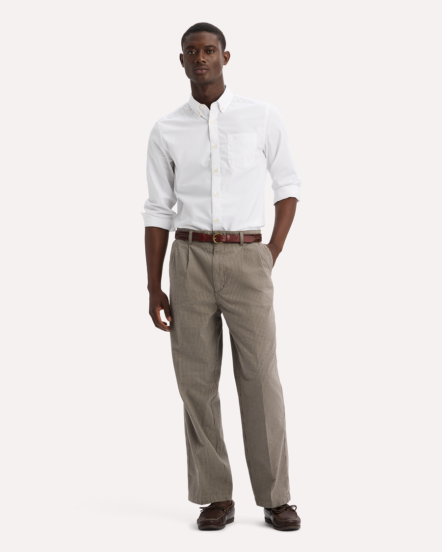 View of model wearing Lemon Pepper Eighty-Six Original Pleated Chinos, Loose Fit.