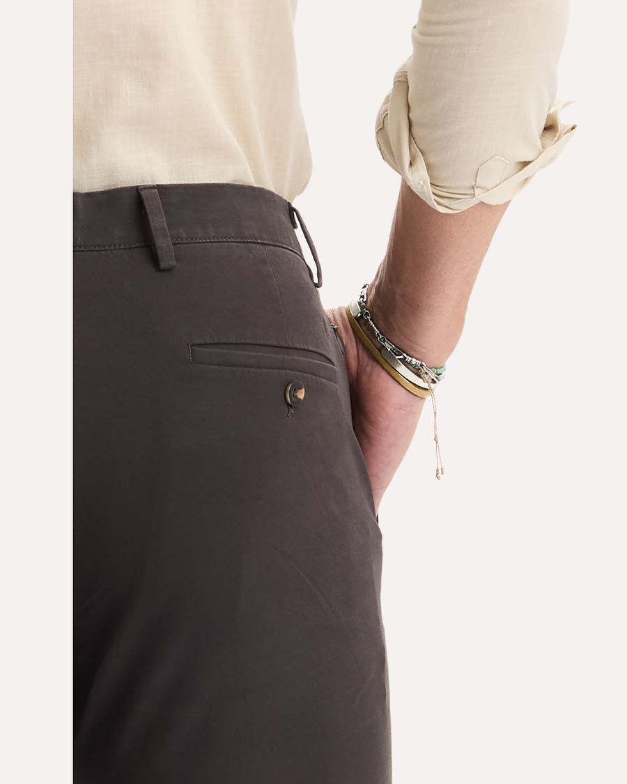 View of model wearing Licorice Crafted Khaki Pants, Slim Tapered Fit.