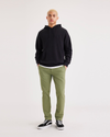 Front view of model wearing Loden Green Men's Skinny Fit Smart 360 Flex California Chino Pants.