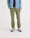 Front view of model wearing Loden Green Men's Slim Fit Smart 360 Flex California Chino Pants.