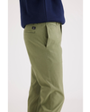 Side view of model wearing Loden Green Men's Slim Fit Smart 360 Flex California Chino Pants.