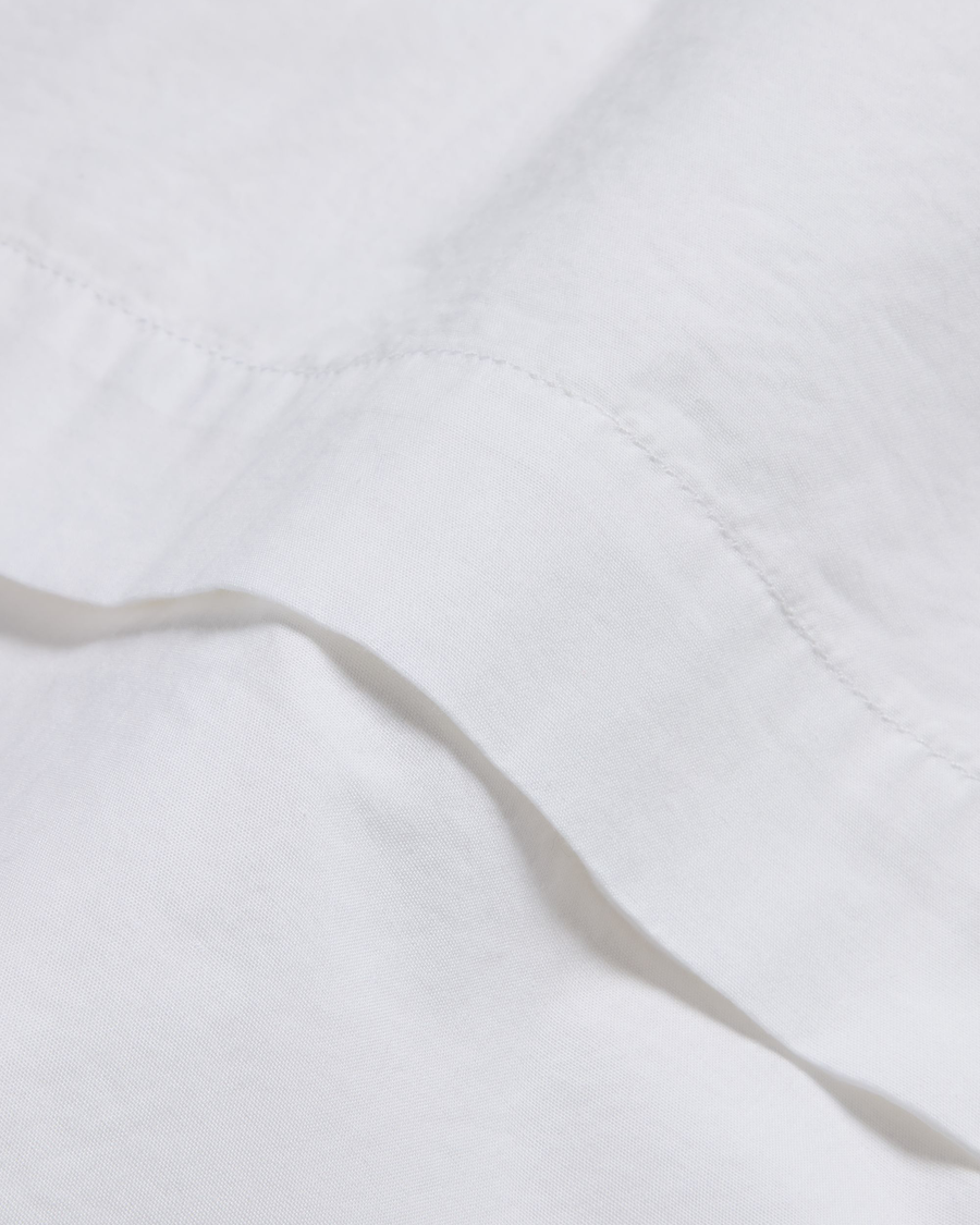 View of model wearing Lucent White Boxy Cropped Shirt, Relaxed Fit.