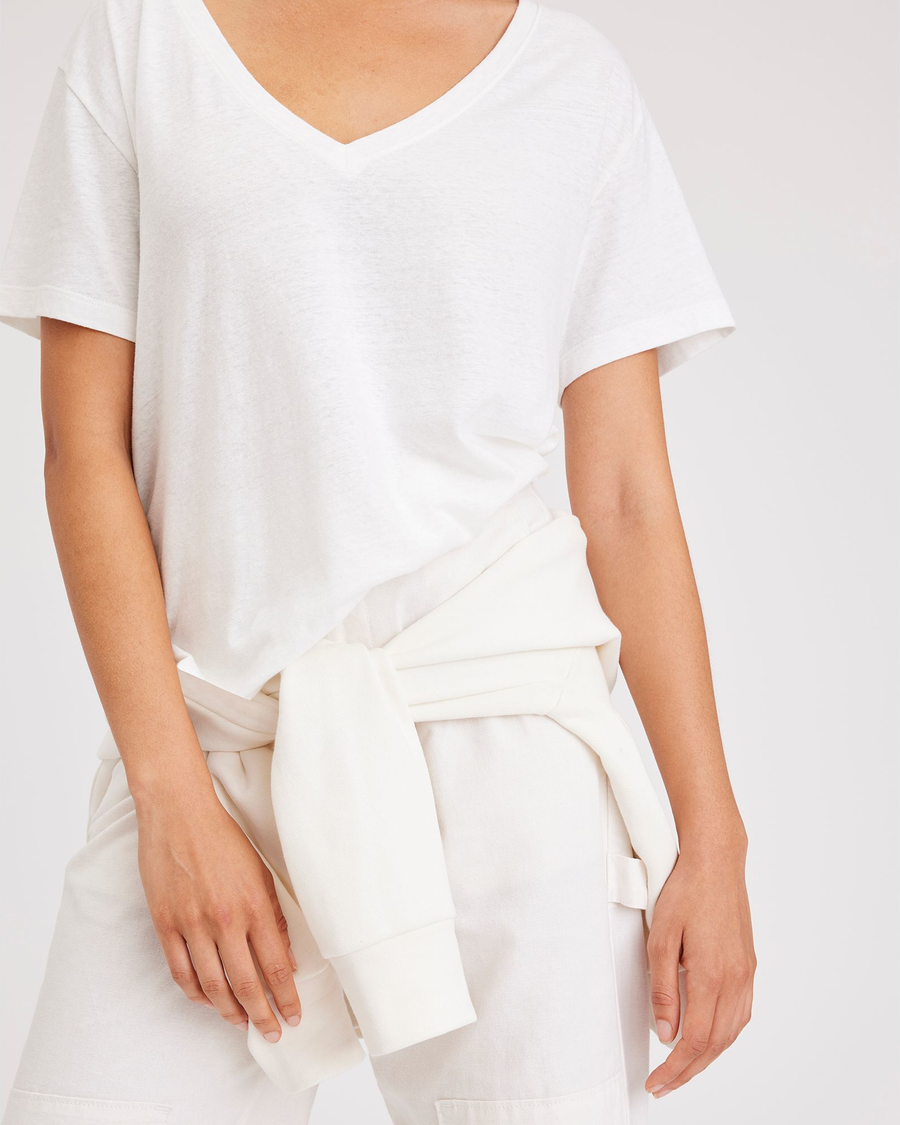 View of model wearing Lucent White Deep V-Neck Tee, Regular Fit.