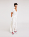 View of model wearing Lucent White Deep V-Neck Tee, Regular Fit.