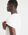 View of model wearing Lucent White Men's Regular Fit Original Tee Shirt.