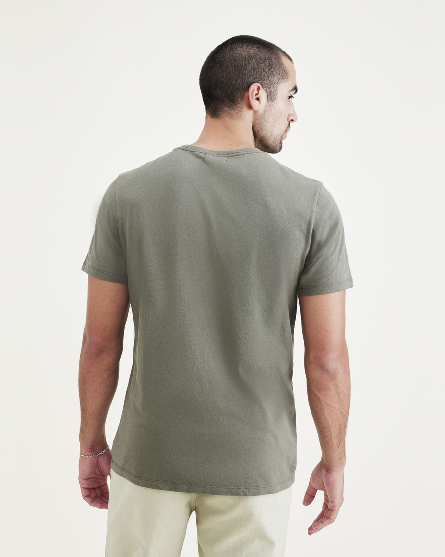 Back view of model wearing Lucent White Men's Slim Fit Logo Tee.