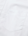 View of model wearing Lucent White Signature Shirt Long Sleeve with Stain Defender®, Slim Fit.