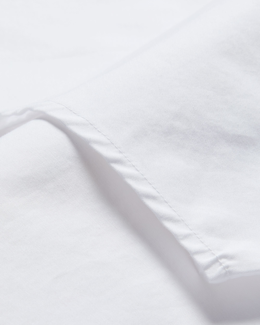 View of model wearing Lucent White Signature Shirt Long Sleeve with Stain Defender®, Slim Fit.