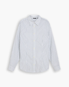 View of model wearing Lucent White Signature Shirt with Stain Defender®, Slim Fit.