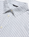 View of model wearing Lucent White Signature Shirt with Stain Defender®, Slim Fit.