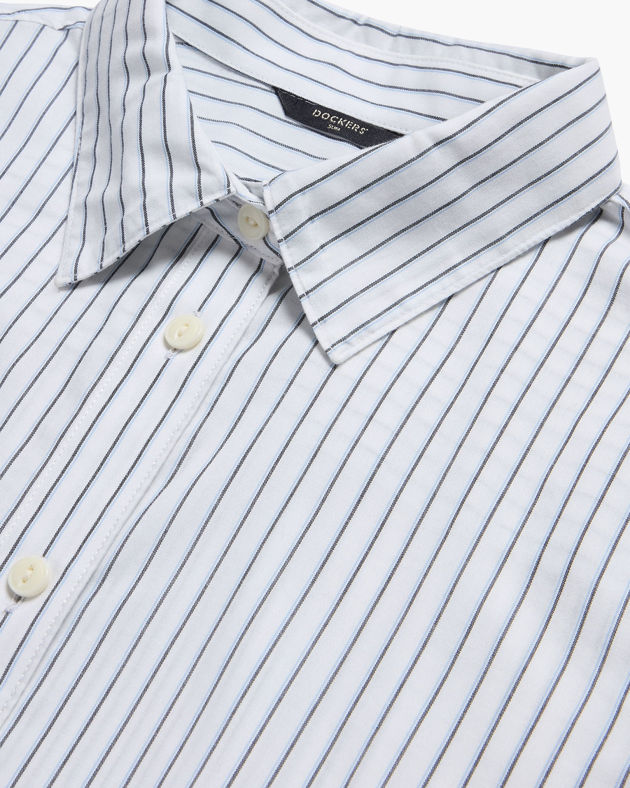 View of model wearing Lucent White Signature Shirt with Stain Defender®, Slim Fit.