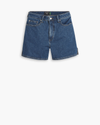View of model wearing Medium Wash Women's  High-Rise Shorts.