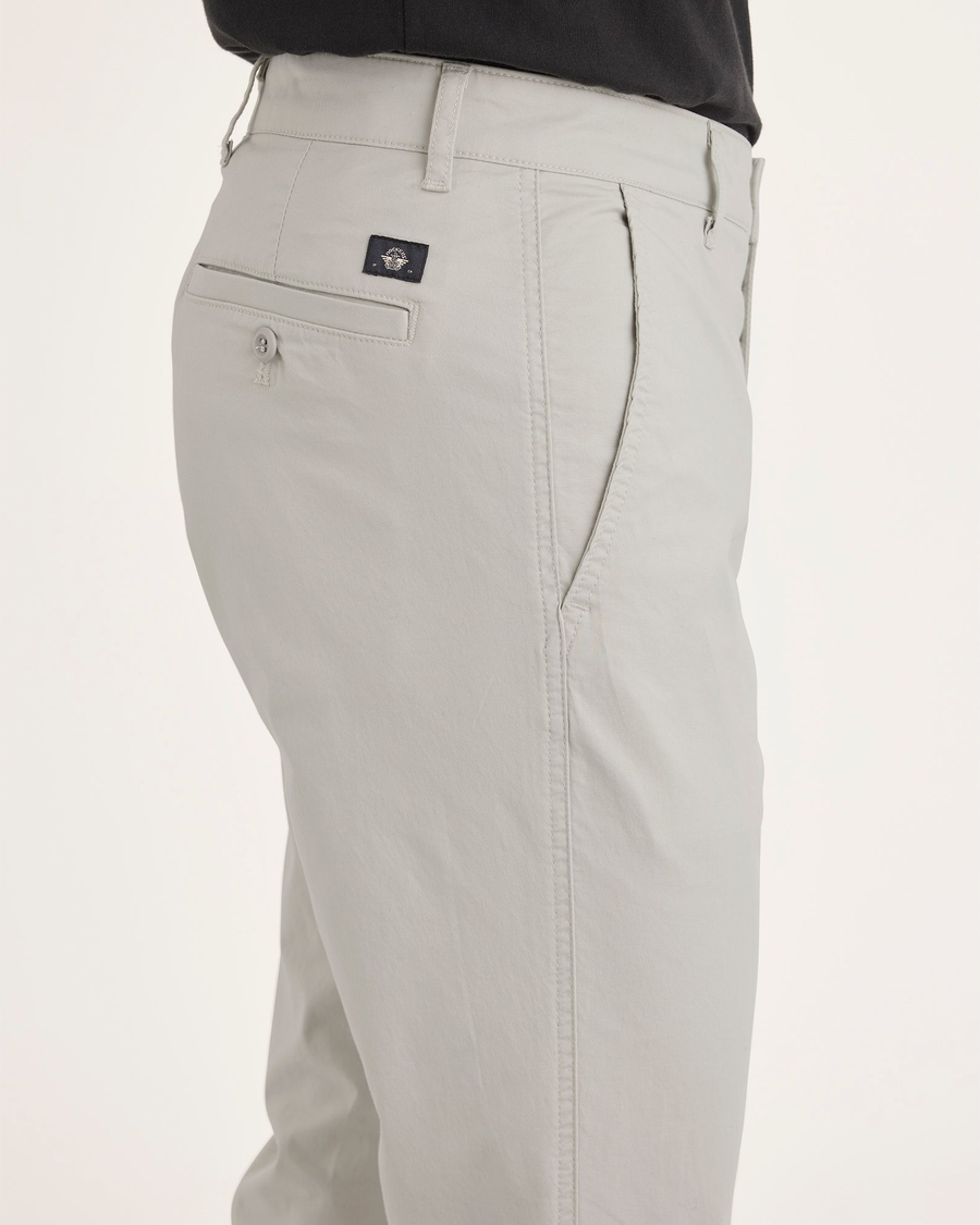 Side view of model wearing Moonstruck Men's Skinny Fit Original Chino Pants.