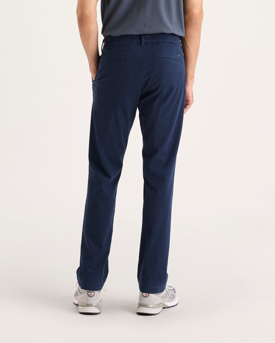 Back view of model wearing Navy Blazer Go Activeflex Chino, Slim Fit.
